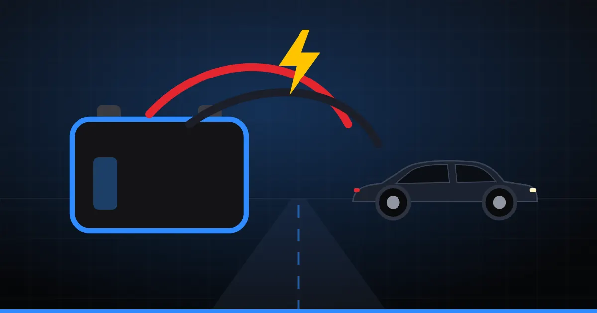 Illustration d'une batterie déchargée reliée par des câbles de démarrage à une voiture